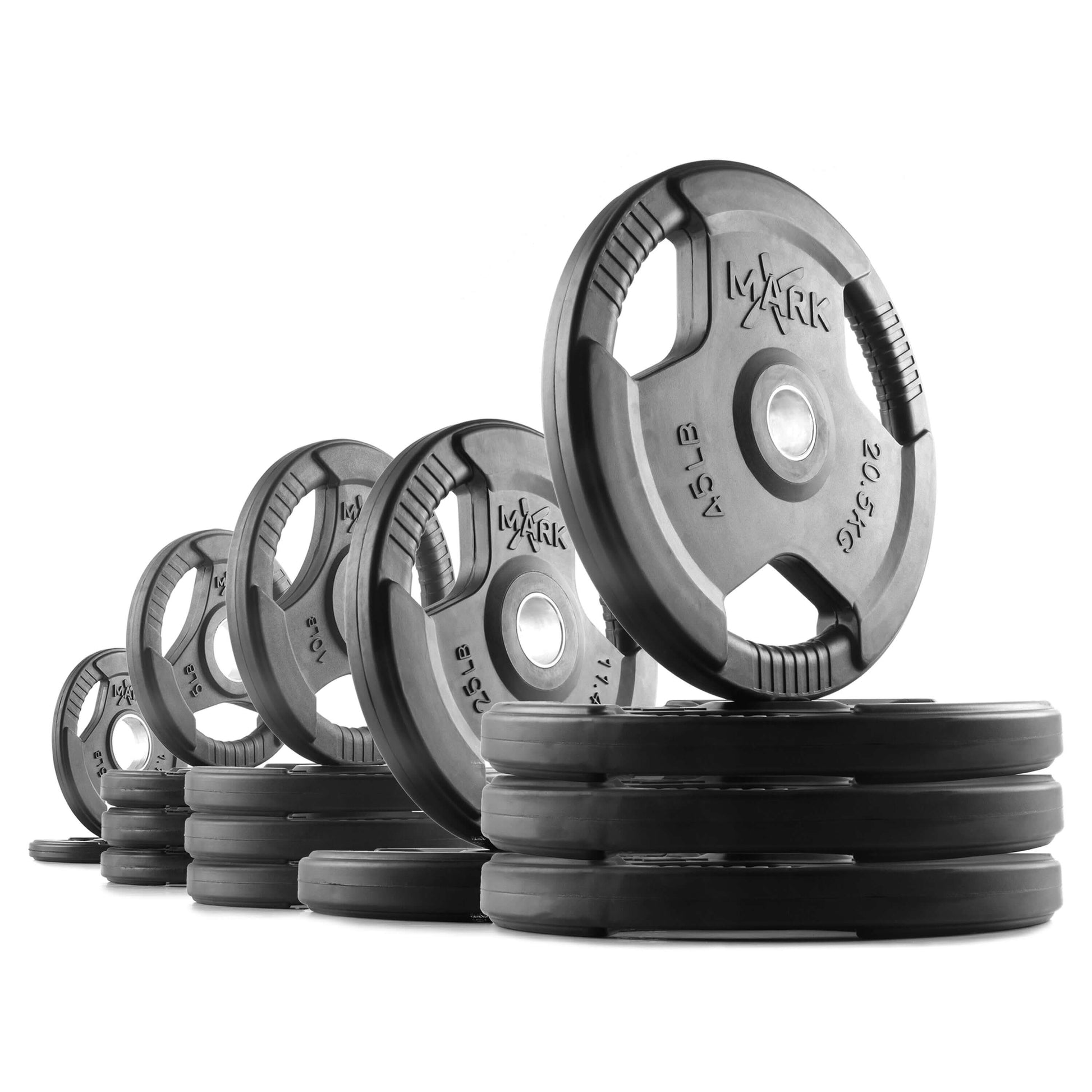 Tri-Grip Olympic weight plates stacked and arranged, showcasing different weights for strength training.