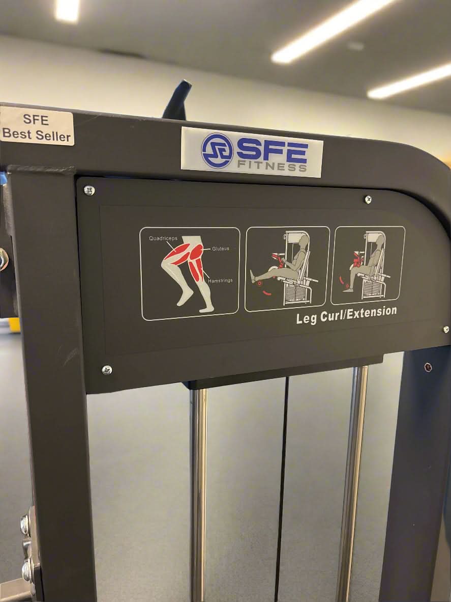 SFE Seated Selectorized Leg Extension & Leg Curl Machine - close up view of machine label
