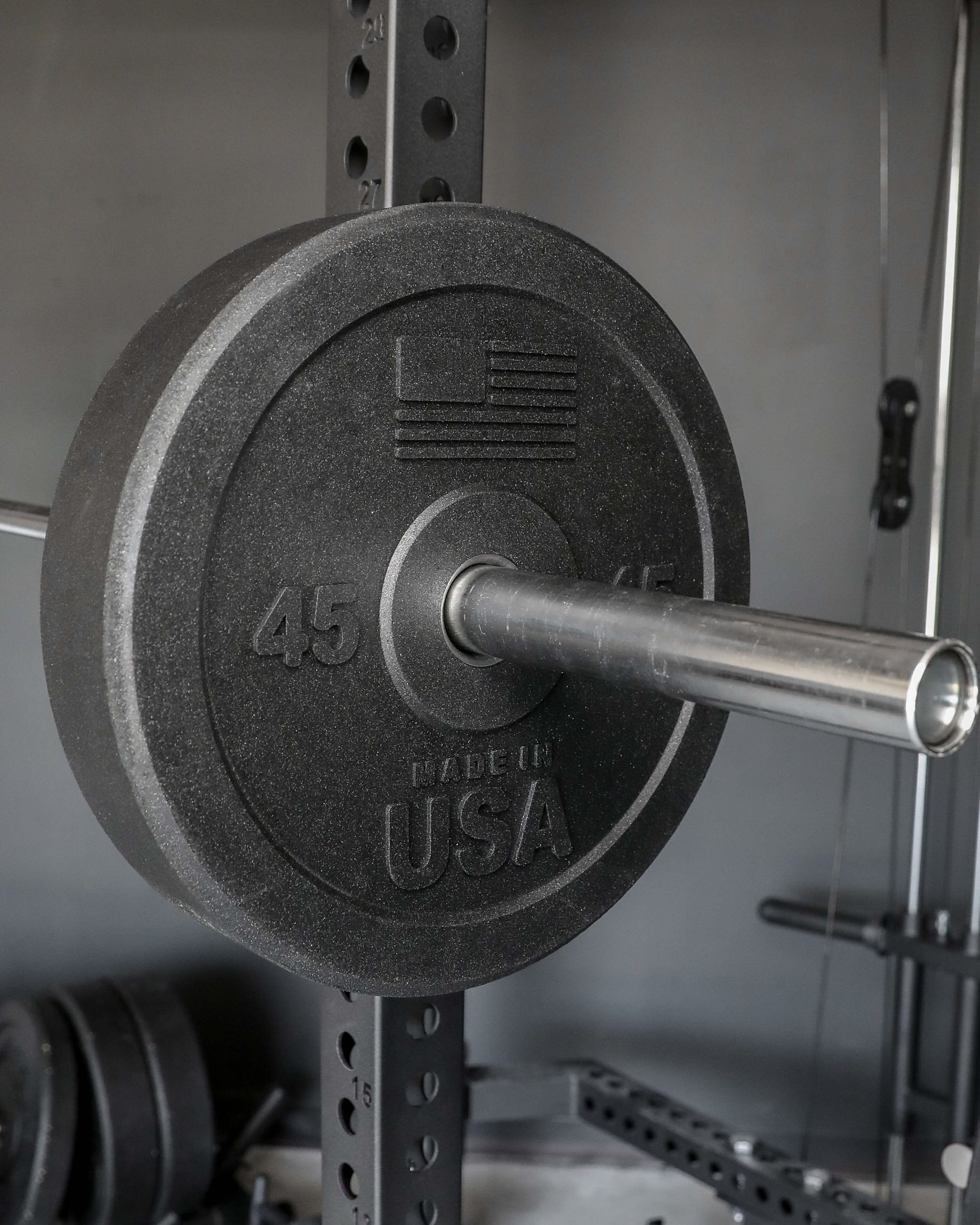 USA Bumper Plate Set - close up view on a barbell (45 lbs)