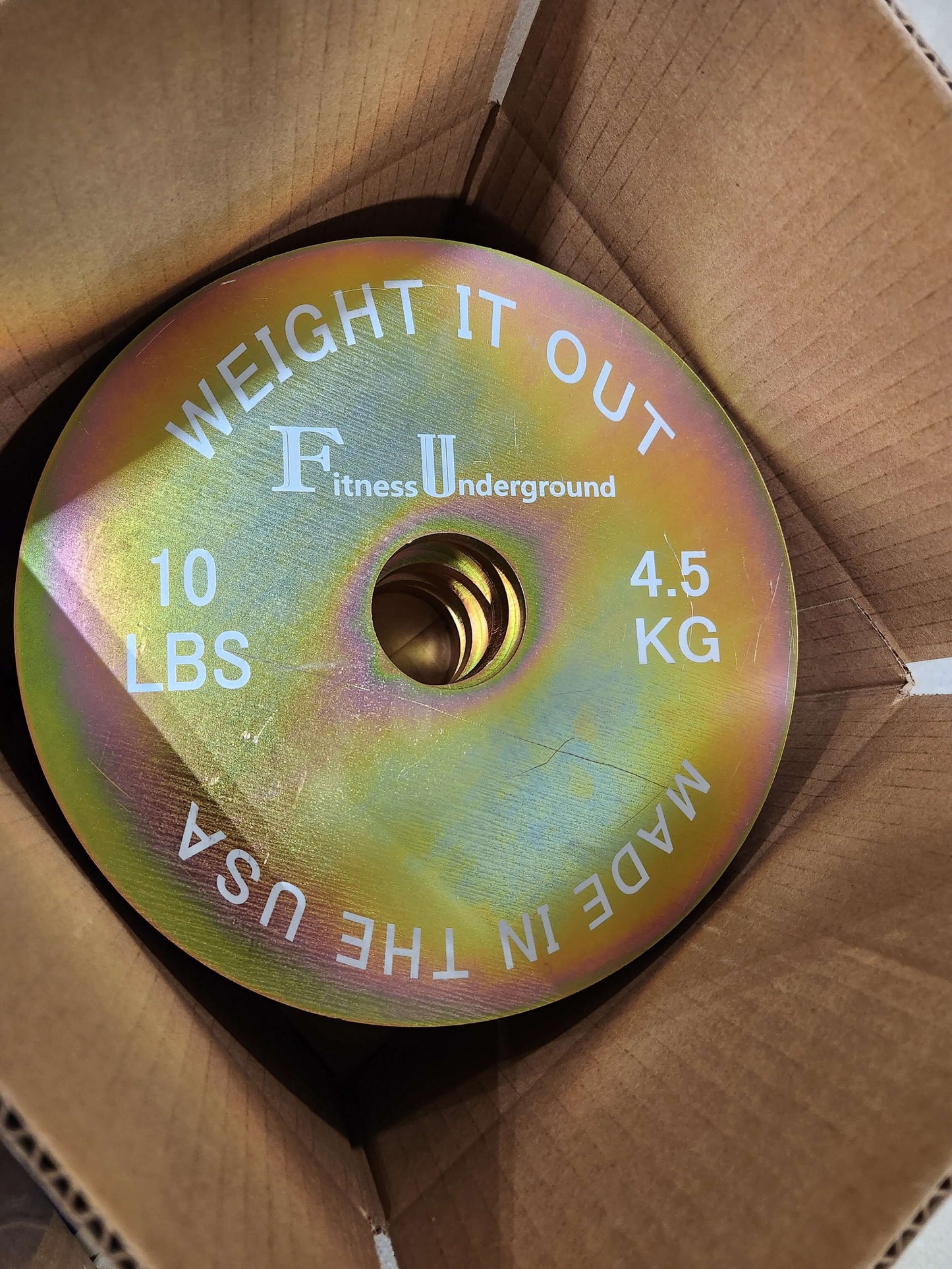 Custom Engraved Solid Steel Calibrated Weight Plate Pairs - top view of plates in the packaging box
