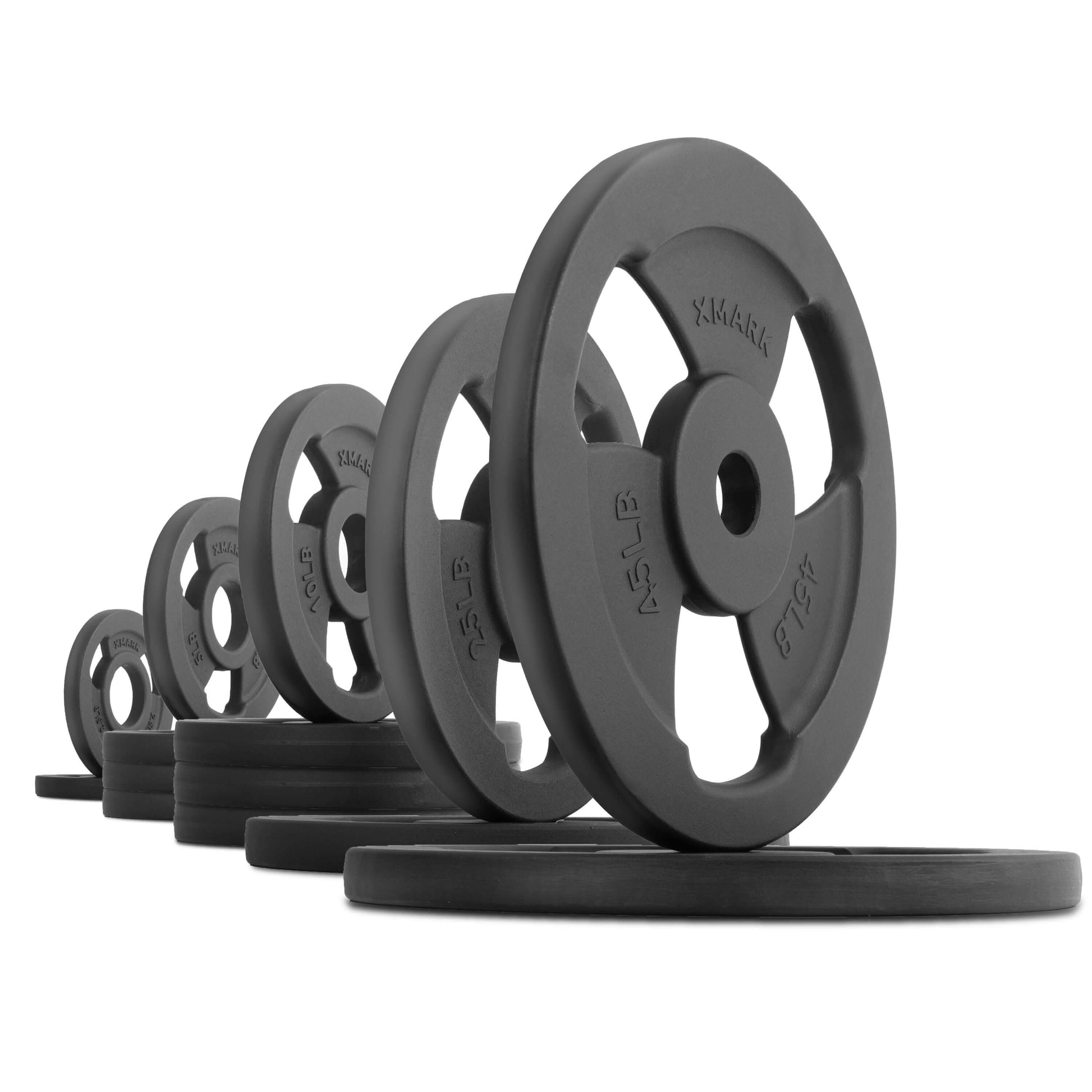 Various Iron Horse cast iron Olympic weight plates in a row, showcasing classic design for strength training.