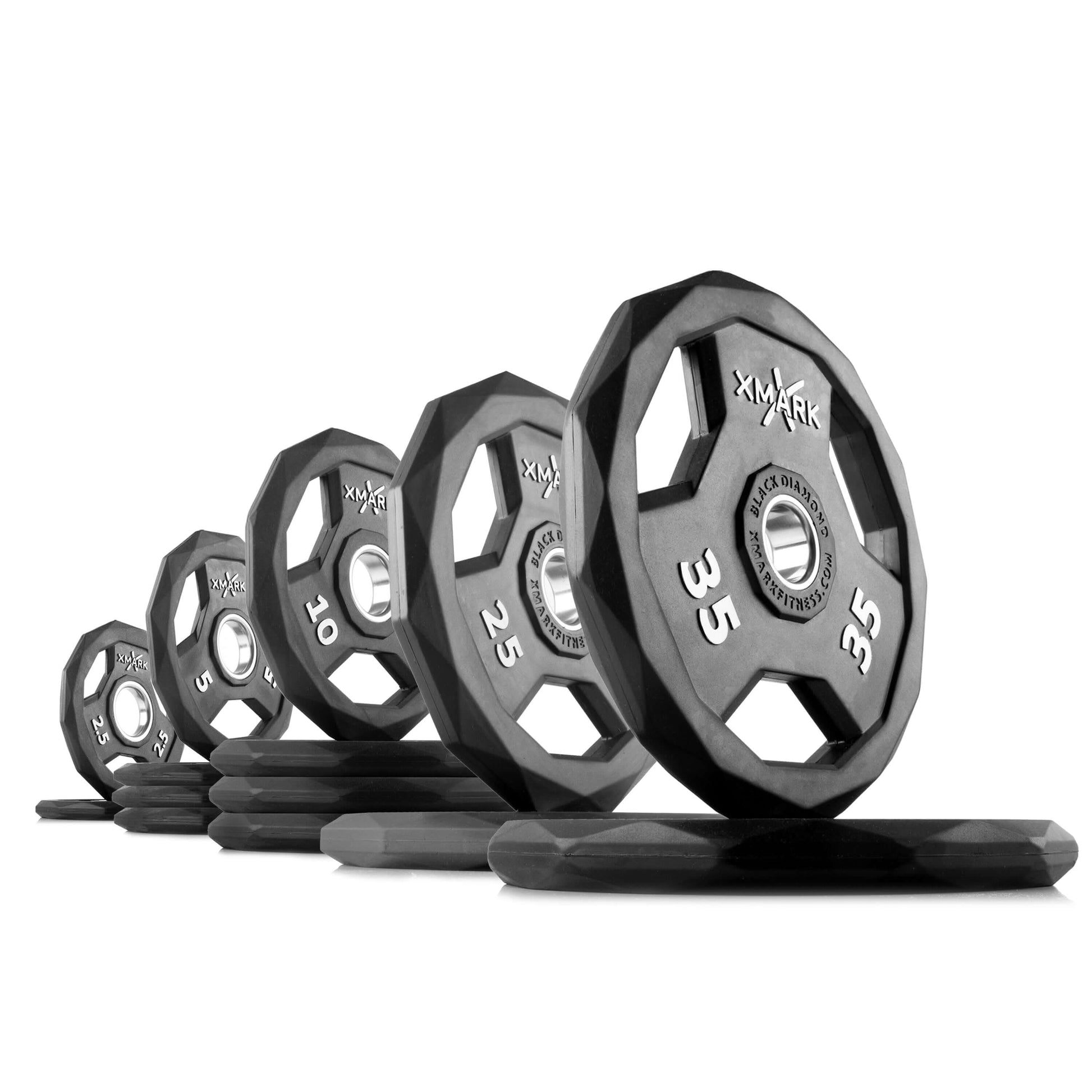 Black Diamond Olympic weight plates in various weights, showcasing their durable rubber encasing and unique design.
