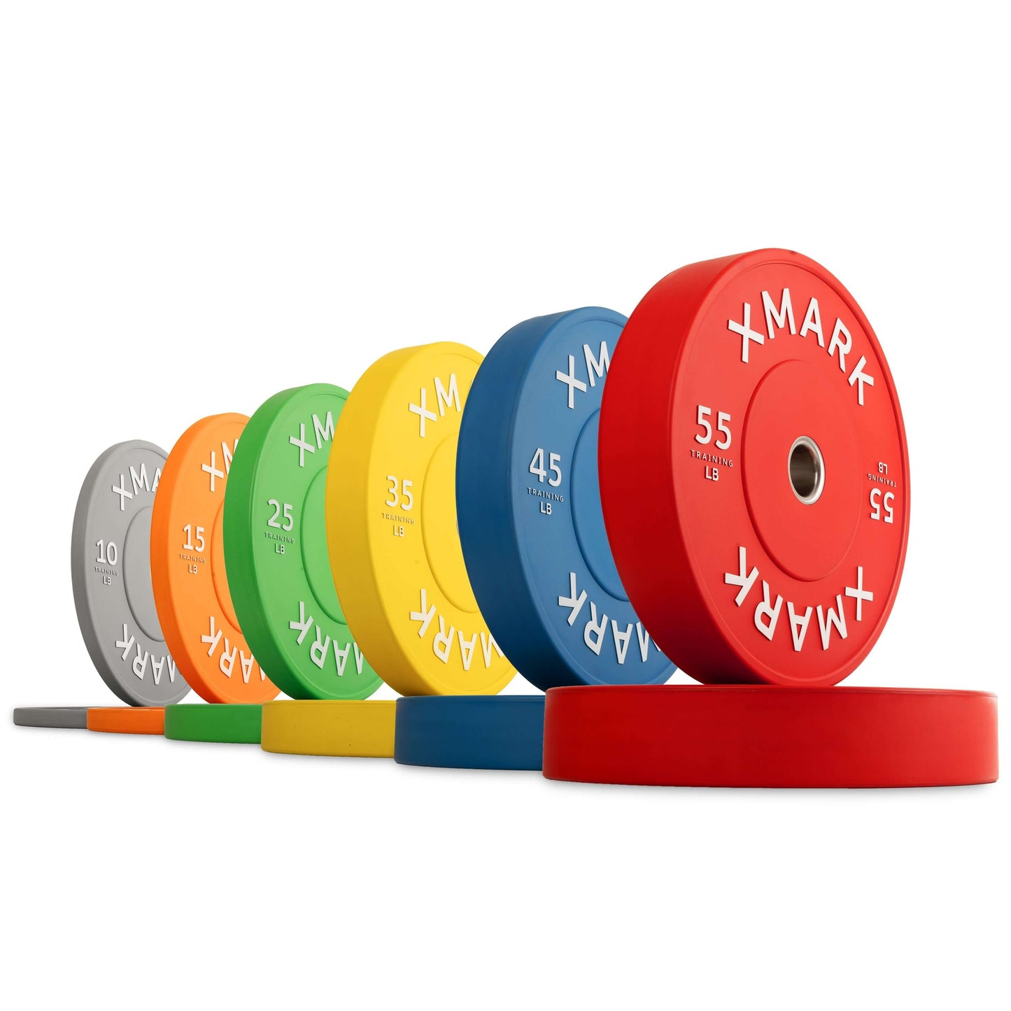 Colorful commercial bumper plates arranged from light to heavy, designed for durability and precision in weightlifting.