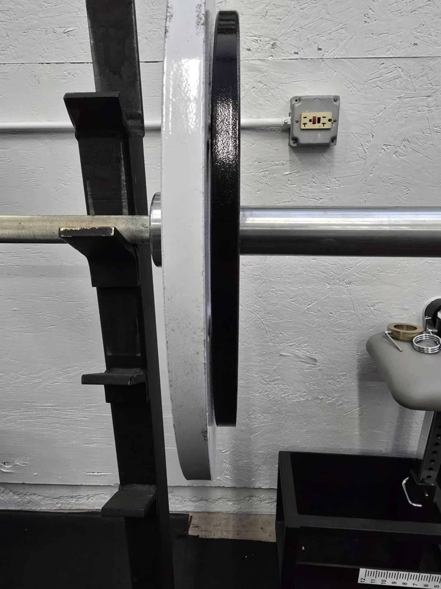 Cast Iron Machined Weight Plate Sets - side view of plates loaded on barbell sleeve