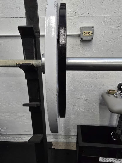 Cast Iron Machined Weight Plate Sets - side view of plates loaded on barbell sleeve