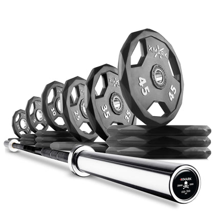 Set of XMark Olympic weight plates (2x45, 1x35, 1x25) next to a shiny Olympic barbell, suitable for strength training.