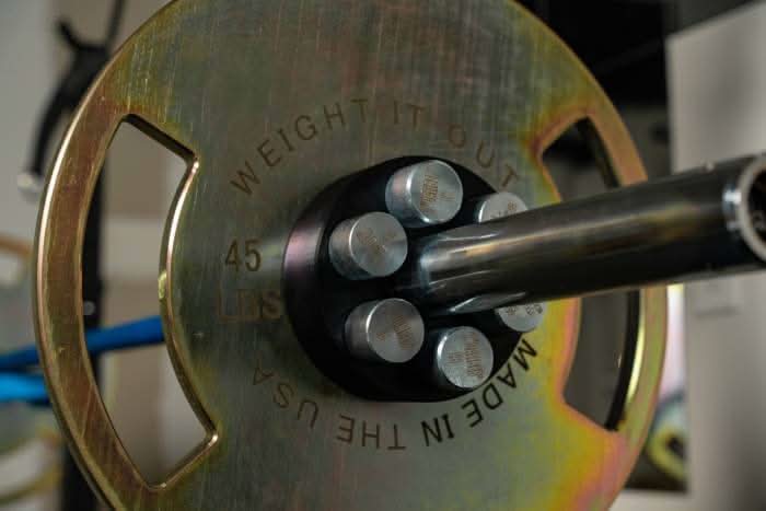 Lock And Load Revolver Micro Loading Plates - front view loaded on the barbell