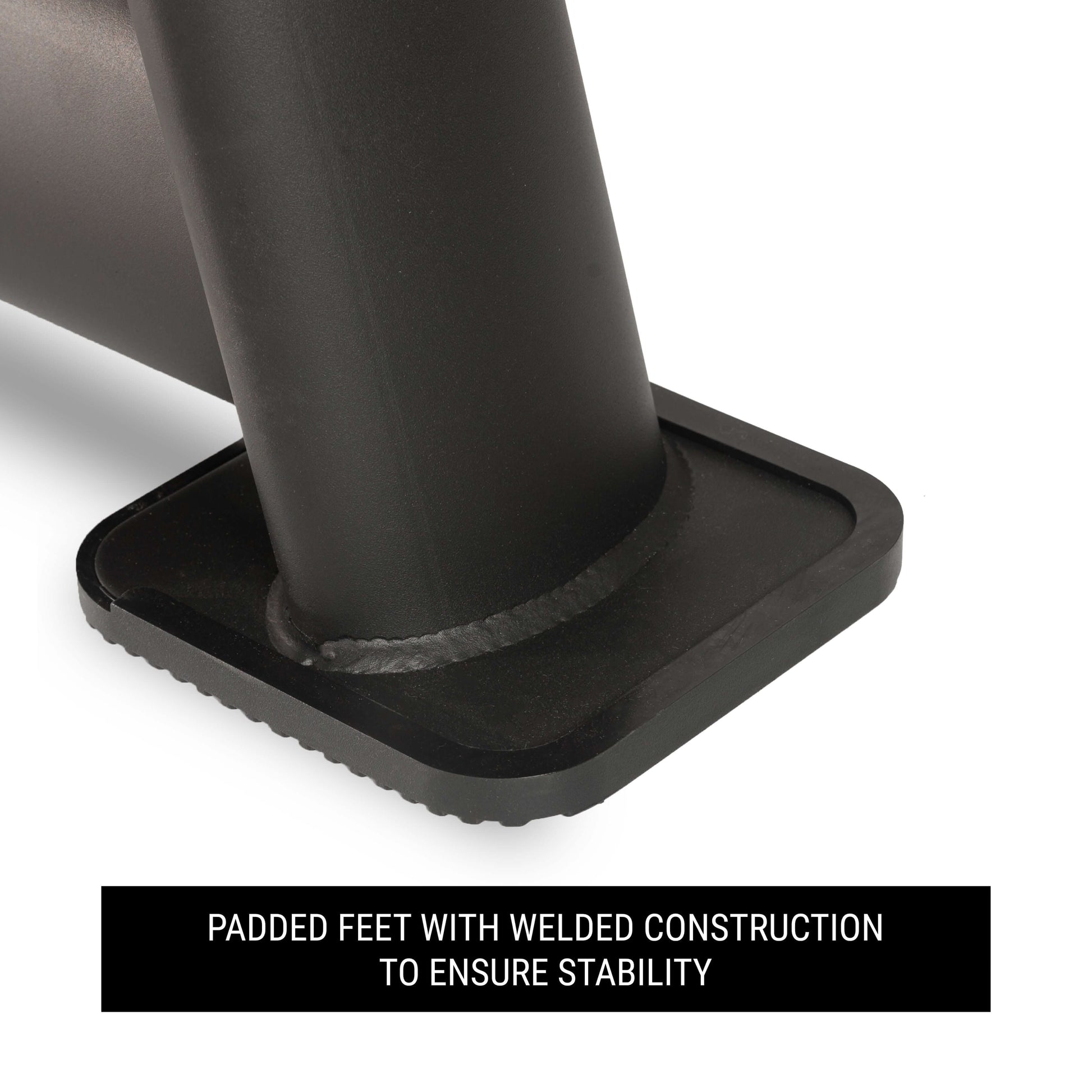 Close-up of padded feet on a dumbbell rack, featuring welded construction for enhanced stability.