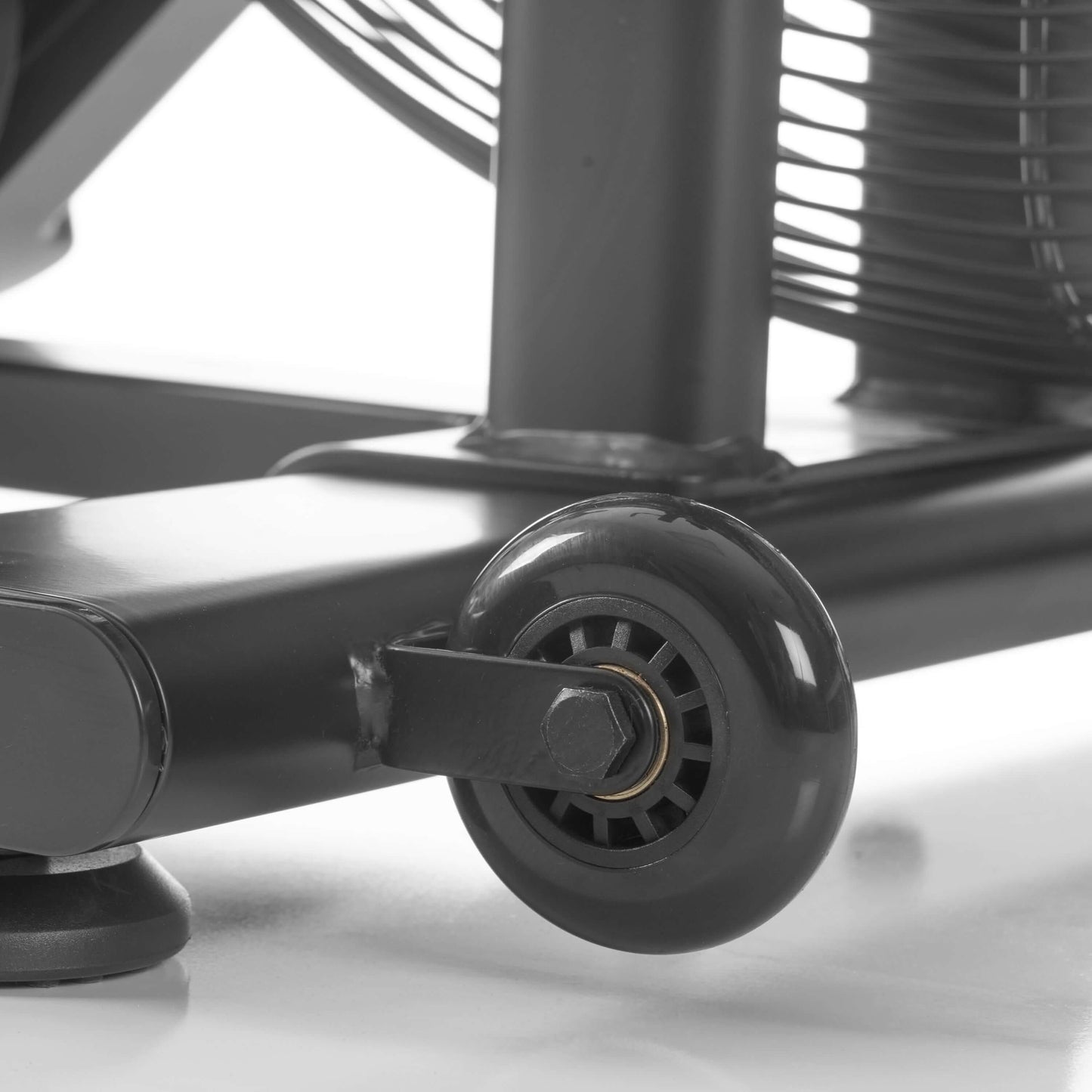 Close-up of CAT 3 Hurricane air bike's durable wheel and frame, showcasing design for gym use and mobility.
