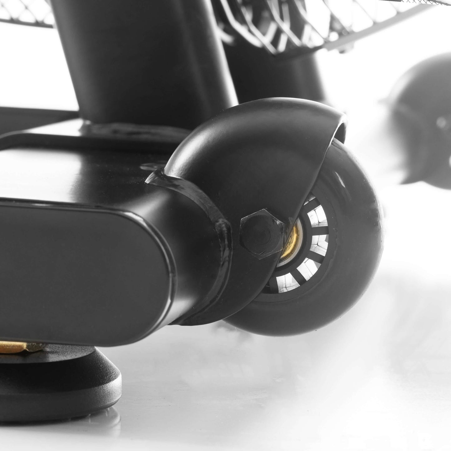 Close-up of CAT 5 Hurricane Air Bike wheel and base, showcasing durable construction for high-performance workouts.