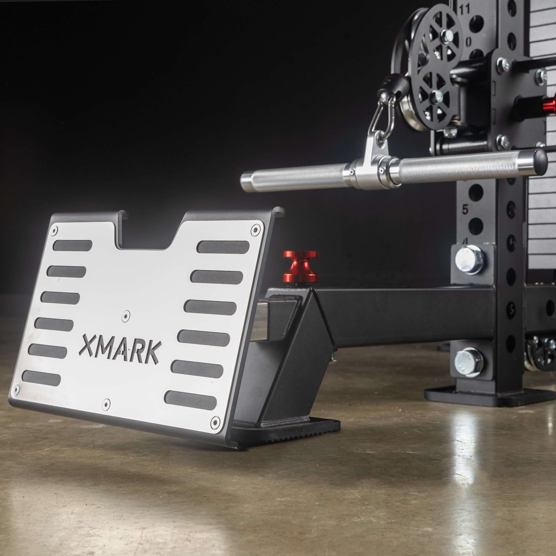 XMARK functional trainer footplate close-up, showcasing adjustable support and robust design, ideal for athletes.