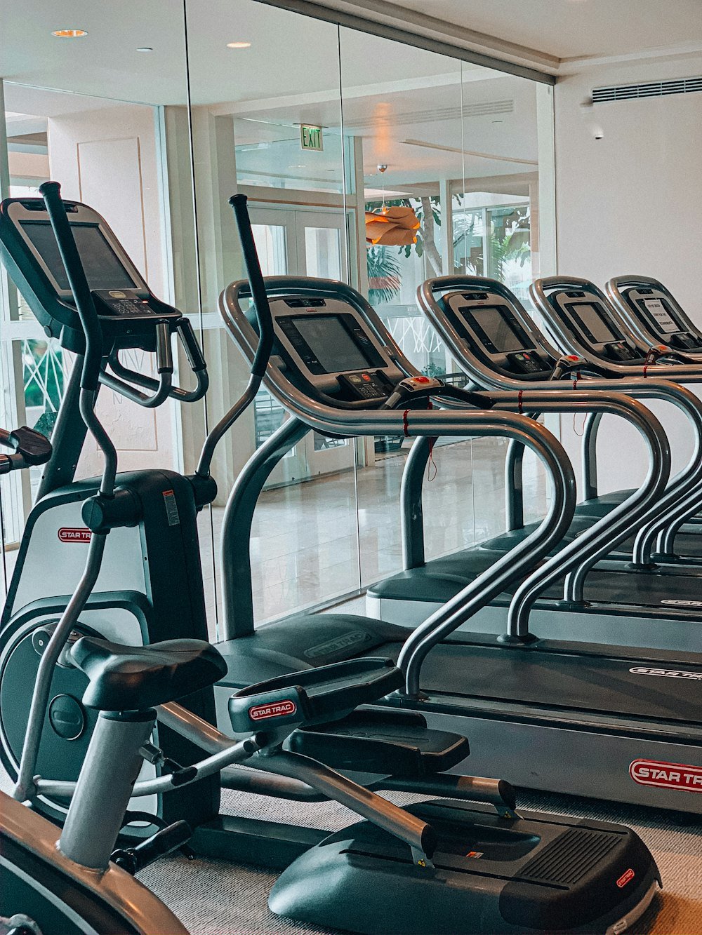 Line of commercial treadmills in a fitness facility